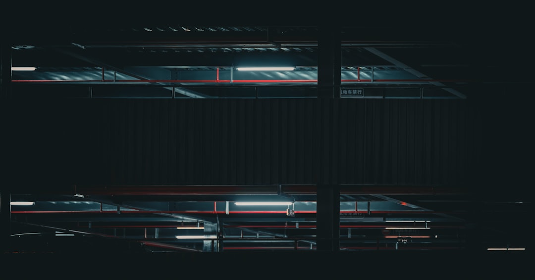 A black and white photo of a window in the dark