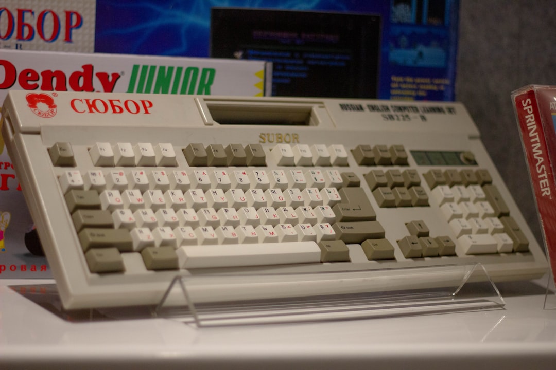 Vintage computer keyboard with display and packaging.